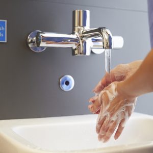 Close Up Of Medical Staff Washing Hands